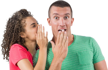 Businesswoman whispering secret into male colleague's ear