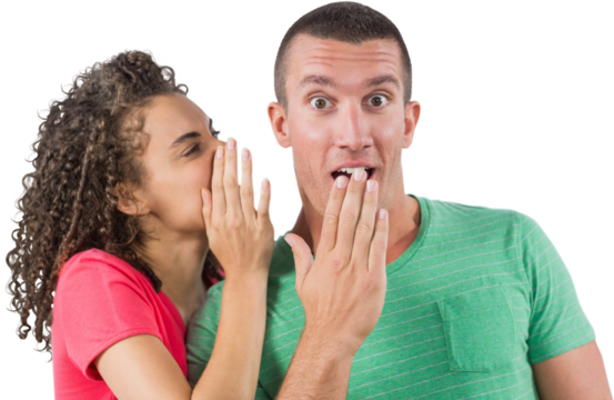 Businesswoman whispering secret into male colleague's ear