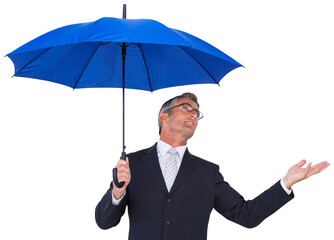 Businessman holding blue umbrella with hand out