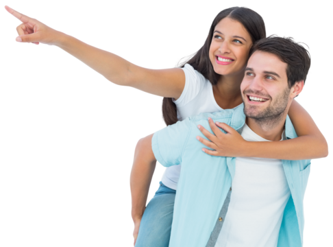 Happy casual man giving pretty girlfriend piggy back