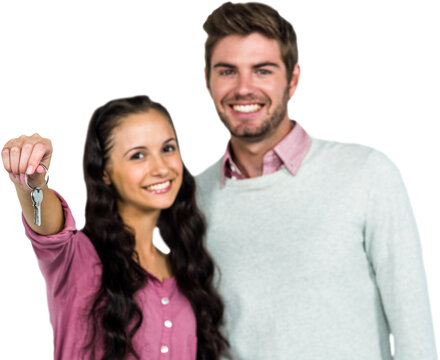 Portrait of happy couple holding keys 
