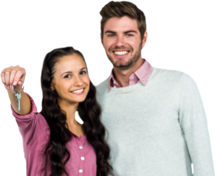 Portrait of happy couple holding keys 