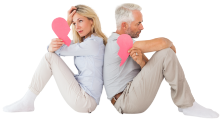 Unhappy couple sitting while holding broken heart