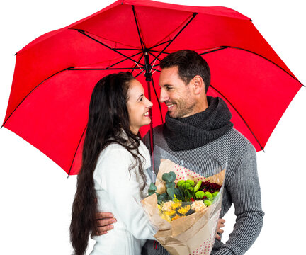 Smiling couple holding umbrella and bouquet - Powered by Adobe