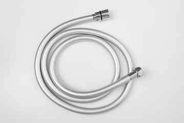 New flexible rubber shower hose on a white background. 