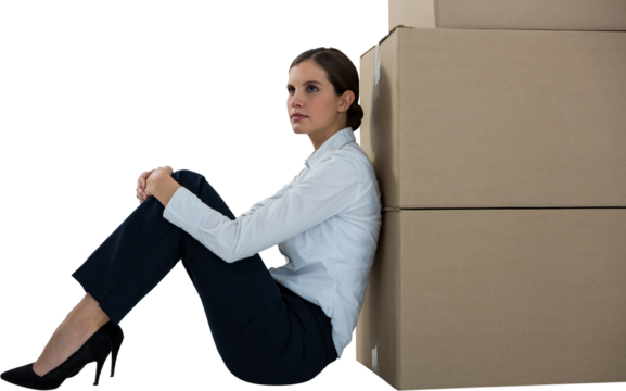 Businesswoman leaning on cardboard boxes against white background - Powered by Adobe