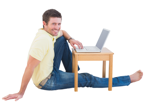 Smiling man using a laptop