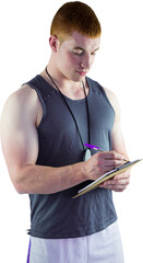 Fit personal trainer writing on clipboard