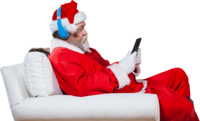 Santa Claus reading on digital tablet