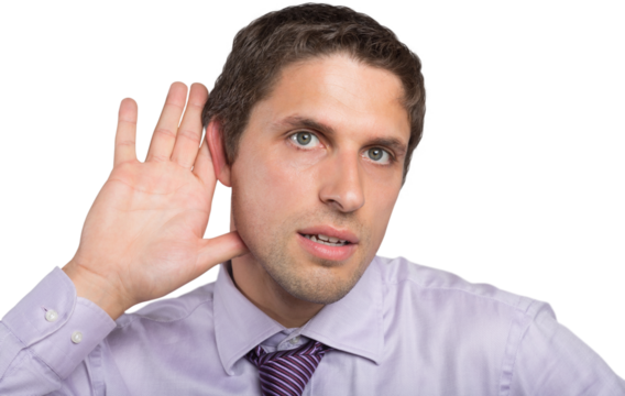 Close-up of green eyed businessman with hand to ear - Powered by Adobe