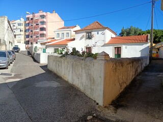 Detached house in Lisbon in traditional video and multi-storey modern houses in the background