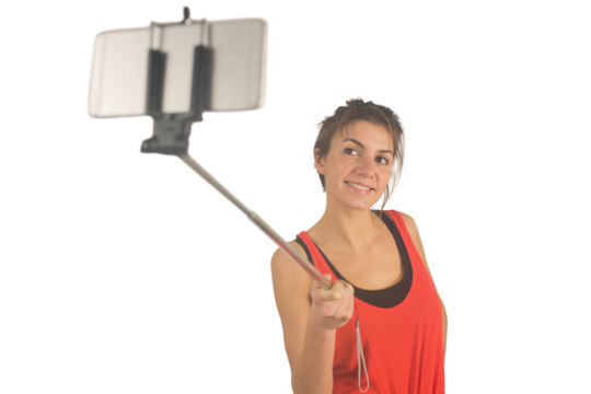 Casual brunette using selfie stick