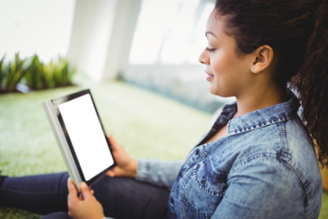Woman looking at digital tablet