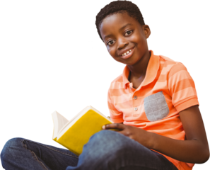 Cute boy reading book in library