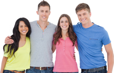 Four friends smiling and embracing each other as they look into the camera