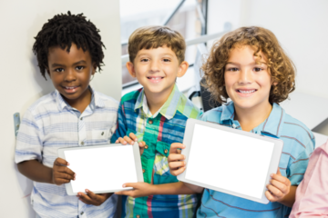 Happy children holding digital tablet