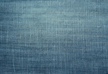 Denim background. Worn blue jeans