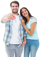 Happy young couple showing new house key