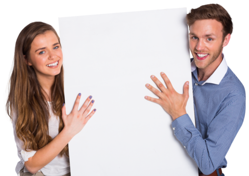 Happy young couple with blank board