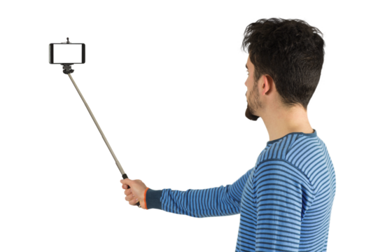 Casual man using a selfie stick
