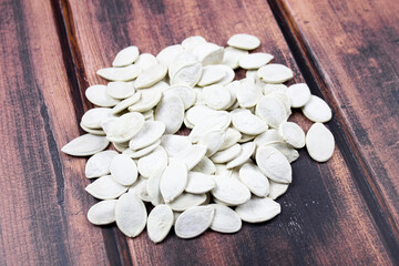 Fototapeta na wymiar Pumpkin seeds. Dried white pumpkin seeds.