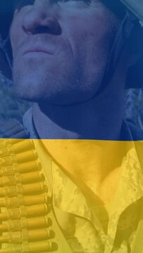 Animation of caucasian soldier with weapon over flag of ukraine