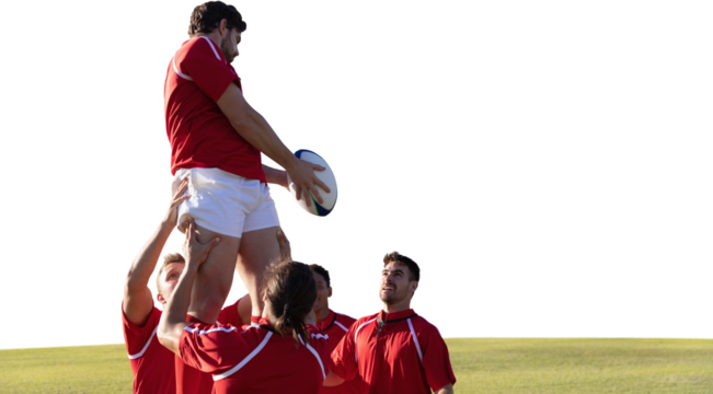 Male rugby players playing rugby in the ground