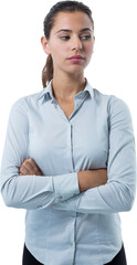 Female executive looking away while standing with arms crossed