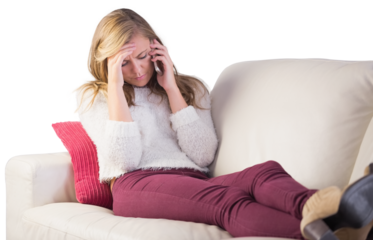 Pretty blonde getting a headache on the couch