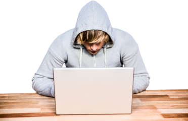  Man in hood jacket hacking a laptop