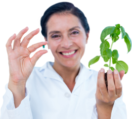 Portrait of scientist holding basil plant and pill