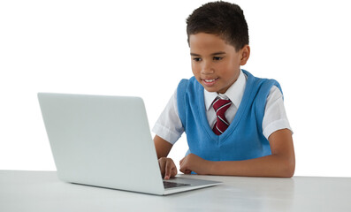 Schoolboy using laptop over white background