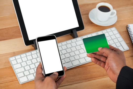 High angle view of businessman doing online shopping on mobile phone - Powered by Adobe