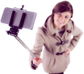 Woman using a selfie stick shot on white background