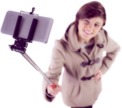 Woman using a selfie stick shot on white background