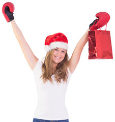 Festive blonde with boxing gloves and shopping bag