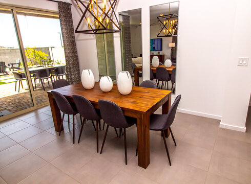 Wooden Table With Eight Chairs In Dining Area