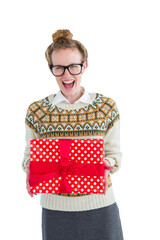 Excited geeky hipster holding present 