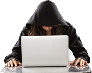 Female hacker sitting by laptop on table 