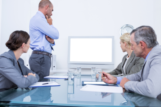 Business team looking at white screen