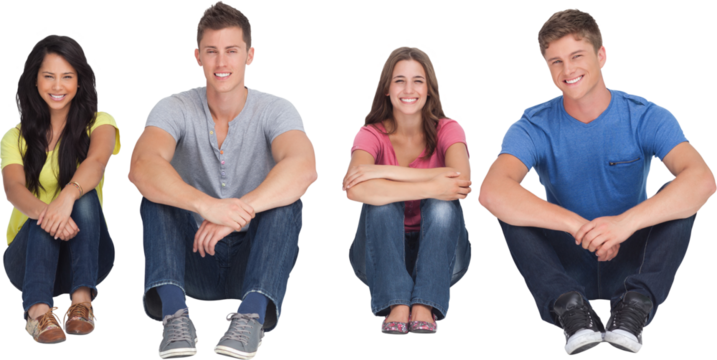 A group of people sitting on the ground together with knees up