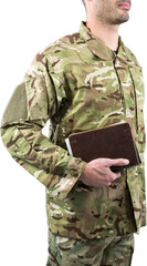 Mid section of soldier holding books while standing 