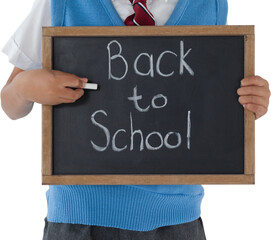 Midsection of schoolboy holding slate with back to school text