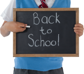 Midsection of schoolboy holding slate with back to school text