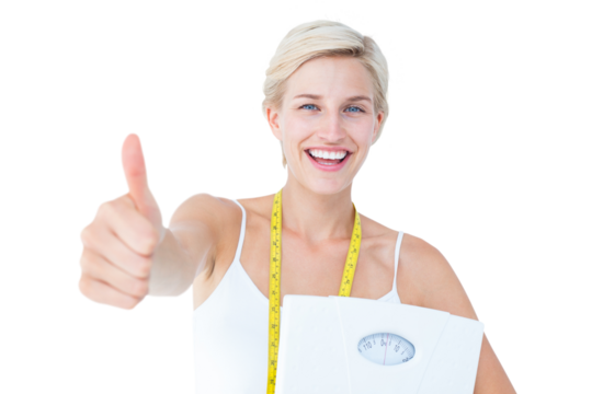 Happy woman holding scales with thumbs up - Powered by Adobe