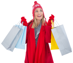 Blonde in winter clothes holding shopping bags