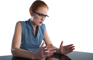Young businesswoman gesturing while wearing smart glasses