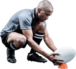 Rugby player keeping ball on kicking tee