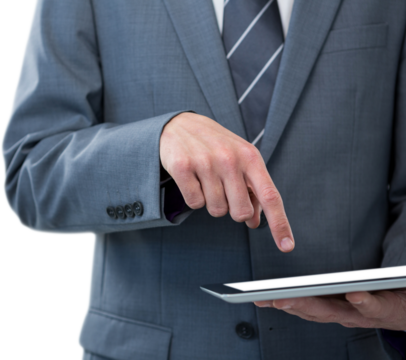 Close up of businessman pointing at tablet screen