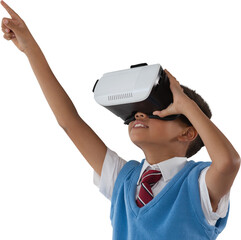 Schoolboy wearing virtual reality headset pointing with arms raised